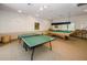 Bright game room with both a ping pong and pool table offering recreational opportunities at 6500 Sunset Way # 501, St Pete Beach, FL 33706