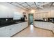 Well-lit kitchen featuring ample counter space, tile floor, and all white cabinets, great for cooking at 6500 Sunset Way # 501, St Pete Beach, FL 33706