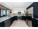 Beautiful kitchen with stainless steel appliances and a view of the water from the window at 6500 Sunset Way # 501, St Pete Beach, FL 33706