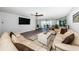 Comfortable living room with modern furnishings, and view from the sliding glass doors at 6500 Sunset Way # 501, St Pete Beach, FL 33706