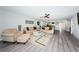 Spacious living room featuring neutral tones, stylish furnishings, and access to the dining area at 6500 Sunset Way # 501, St Pete Beach, FL 33706