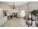Spacious lobby with high ceilings, tile flooring, a chandelier, and comfortable seating at 6500 Sunset Way # 501, St Pete Beach, FL 33706