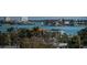 A stunning view of the bay showcasing local homes and lush mature foliage at 6500 Sunset Way # 501, St Pete Beach, FL 33706