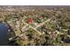 Aerial view of the property highlighting the home's location on a sprawling lot and waterway access at 6705 Myrna Dr, Tampa, FL 33619