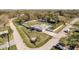 Aerial view of the property showcases a large lot, pool and mature trees in the surrounding landscape at 6705 Myrna Dr, Tampa, FL 33619