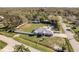 Sprawling property with fenced yard, pool, and lush landscaping, perfect for outdoor living at 6705 Myrna Dr, Tampa, FL 33619