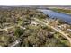 A beautiful aerial view of the property near the river, showcasing the pool and surrounding landscape at 6705 Myrna Dr, Tampa, FL 33619