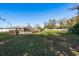 Backyard view featuring a fenced pool, open grassy area and large utility shed at 6705 Myrna Dr, Tampa, FL 33619