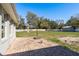 The brick patio overlooks the expansive lawn, ideal for outdoor activities and entertainment at 6705 Myrna Dr, Tampa, FL 33619