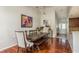 Chic dining area with hardwood floors, stylish furnishings, and unique artwork at 6705 Myrna Dr, Tampa, FL 33619