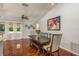 Elegant dining room with a rustic table setting and ample natural light at 6705 Myrna Dr, Tampa, FL 33619