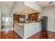 Well-equipped kitchen with granite countertops, stainless steel appliances, and bar seating at 6705 Myrna Dr, Tampa, FL 33619