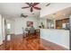 Open-concept living and dining area with hardwood floors and stylish design at 6705 Myrna Dr, Tampa, FL 33619