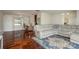 Open living space connects seamlessly to an office area, featuring hardwood floors and ample seating at 6705 Myrna Dr, Tampa, FL 33619