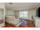 Spacious living room with hardwood floors, a large window for light, and comfortable seating at 6705 Myrna Dr, Tampa, FL 33619