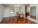 Office space boasts hardwood floors, natural light, and convenient access to the kitchen area at 6705 Myrna Dr, Tampa, FL 33619