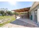 Open patio with a wooden awning, counter, and backyard views at 6705 Myrna Dr, Tampa, FL 33619