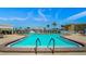 Outdoor community pool with lounge chairs and lush landscaping at 672 Boca Ciega Point N Blvd, St Petersburg, FL 33708