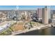 An aerial view of the condo building with a vibrant city skyline backdrop at 777 N Ashley Dr # 915, Tampa, FL 33602