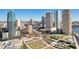 Sweeping aerial shot capturing the bustling downtown cityscape with modern high-rises and vibrant green spaces at 777 N Ashley Dr # 915, Tampa, FL 33602