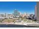 Aerial view showcasing the downtown skyline with modern high-rise buildings and a waterfront park at 777 N Ashley Dr # 915, Tampa, FL 33602