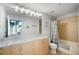 Bathroom featuring double sinks, a large mirror, and a shower with a tub at 777 N Ashley Dr # 915, Tampa, FL 33602