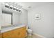Bathroom featuring a large mirror, wood cabinets, and neutral walls at 777 N Ashley Dr # 915, Tampa, FL 33602