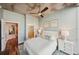 Cozy bedroom with hardwood floors, ceiling fan, and white furniture at 777 N Ashley Dr # 915, Tampa, FL 33602