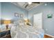 Bedroom with hardwood floors, ceiling fan, and light blue walls at 777 N Ashley Dr # 915, Tampa, FL 33602