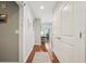 Hallway with wood flooring, white doors, and natural light at 777 N Ashley Dr # 915, Tampa, FL 33602