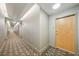 Hallway with patterned carpet leading to unit entrance at 777 N Ashley Dr # 915, Tampa, FL 33602
