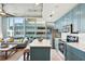 Bright, modern kitchen showcasing an island with seating and city views at 777 N Ashley Dr # 915, Tampa, FL 33602