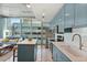 Modern kitchen featuring blue cabinets, stylish countertops, and stainless steel appliances at 777 N Ashley Dr # 915, Tampa, FL 33602