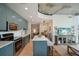 Updated kitchen featuring blue cabinets, stainless steel appliances, and an island with bar seating and open floorplan at 777 N Ashley Dr # 915, Tampa, FL 33602