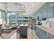 Modern kitchen with stainless steel appliances, blue cabinets, and a breakfast bar at 777 N Ashley Dr # 915, Tampa, FL 33602