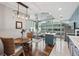 Open-concept living space featuring a kitchen island, dining area, and city views at 777 N Ashley Dr # 915, Tampa, FL 33602