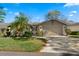 Charming single-story home with well-maintained landscaping, a two-car garage, and a welcoming front entrance at 7791 Pine Trace Dr, Sarasota, FL 34243