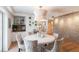 Dining room with stylish decor, modern lighting, and a decorative accent wall at 815 Paradise Way, Sarasota, FL 34242