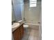 Functional bathroom featuring a shower/tub combo and updated tile at 8480 Southern Charm Cir, Brooksville, FL 34613