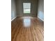 Well-lit room featuring updated floors and neutral paint at 8480 Southern Charm Cir, Brooksville, FL 34613