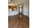 Open-concept living room featuring updated flooring and a view of the kitchen at 8480 Southern Charm Cir, Brooksville, FL 34613