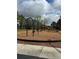The community playground has swings and slides on a mulch base at 8480 Southern Charm Cir, Brooksville, FL 34613