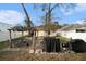 Landscaped backyard with a pergola, patio furniture, bbq, and a well-maintained lawn, perfect for outdoor enjoyment at 918 W Knollwood St, Tampa, FL 33604