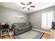 Bedroom featuring hardwood floors, ceiling fan, and natural light at 918 W Knollwood St, Tampa, FL 33604