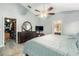 Spacious main bedroom with a ceiling fan, vaulted ceiling, and a walk-in closet near an ensuite bathroom at 918 W Knollwood St, Tampa, FL 33604