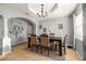 Traditional dining room with chandelier, six chairs, neutral color palette and decor at 918 W Knollwood St, Tampa, FL 33604