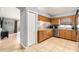 Eat-in kitchen showcasing wood cabinets, stainless steel appliances, and tile flooring at 918 W Knollwood St, Tampa, FL 33604