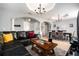 Inviting living and dining areas with tile floors, columns, and a neutral color scheme at 918 W Knollwood St, Tampa, FL 33604