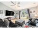 Living room featuring sliding glass doors to a patio and a ceiling fan at 918 W Knollwood St, Tampa, FL 33604