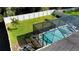 Aerial view of home backyard with white fence and large screened-in pool and patio area at 921 Night Song St, Valrico, FL 33594